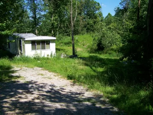 Junky Property with Pond property photo 1
